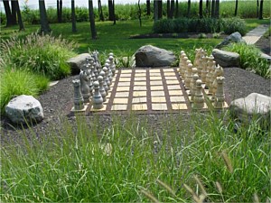 Life-sized chess board with natural landscaping and boulders